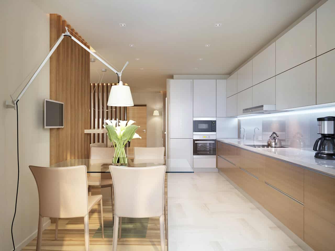 Cocina lineal moderna con armarios blancos y mesa de comedor en Tomelloso