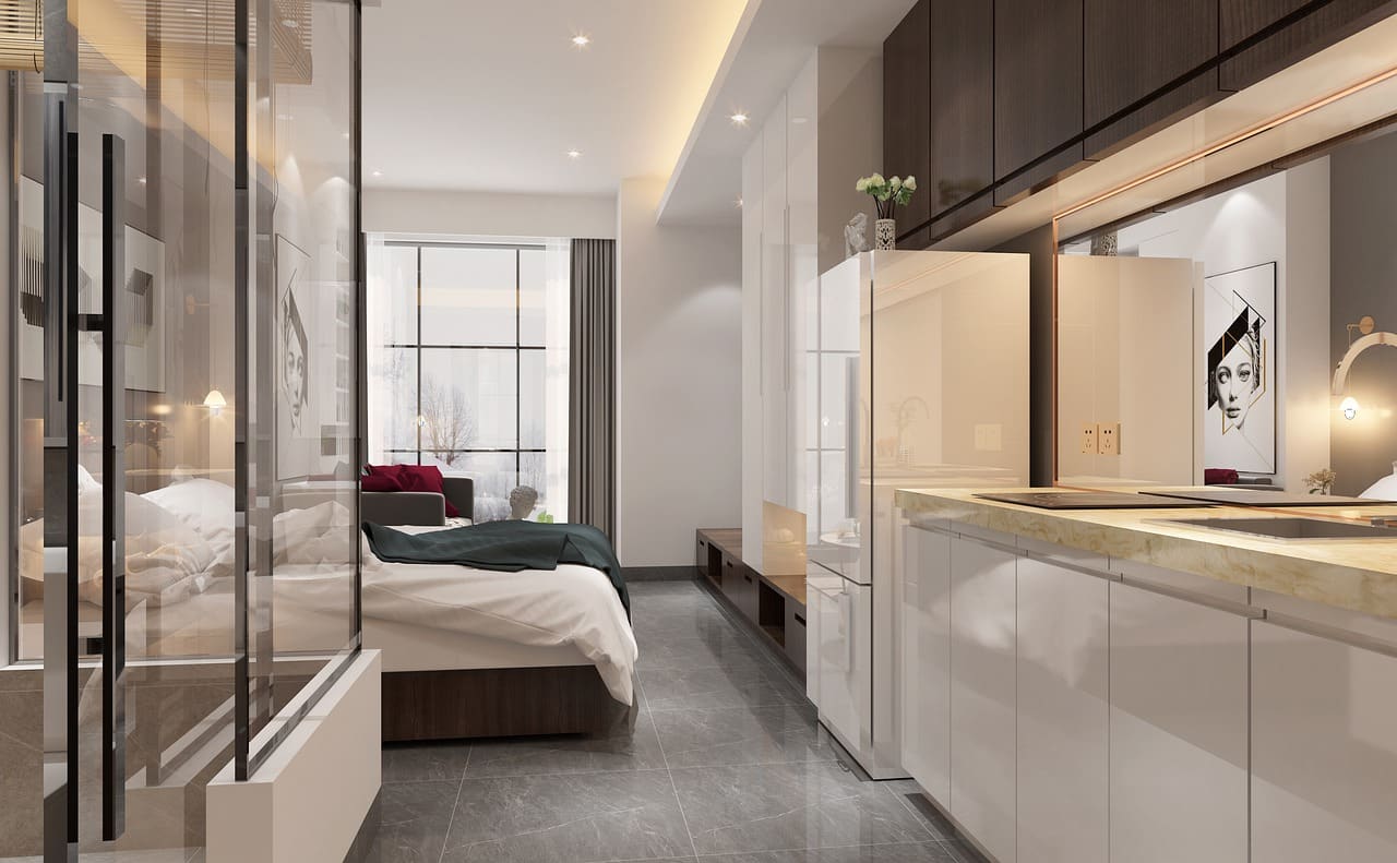 Cocina pequeña de diseño moderno integrada en un apartamento de concepto abierto en Tomelloso